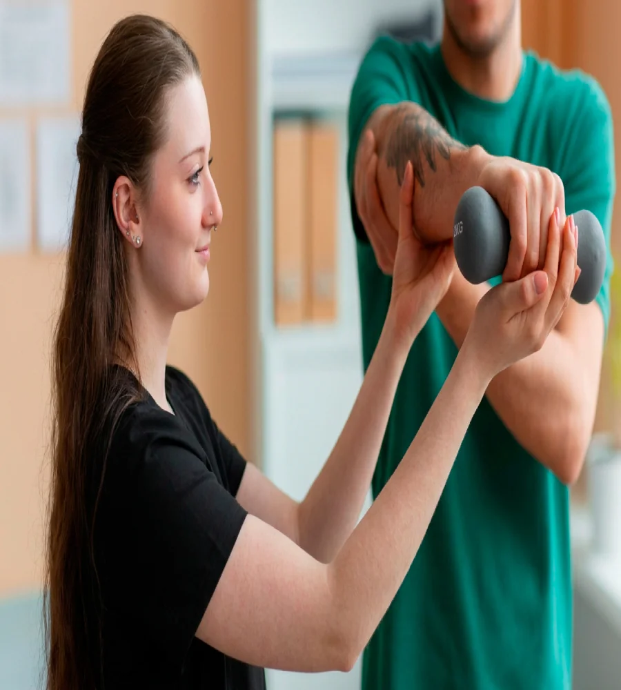 Patient performing supervised therapeutic exercise as part of chiropractic care